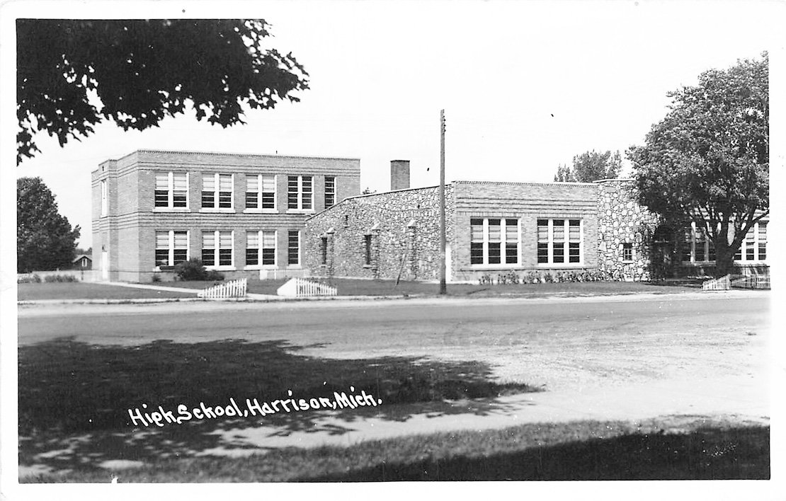The Harrison Community School in the 1930’s shown here with the stone addition built by the Works Progress Administration.  The community building was torn down in the early 1970s and the school building was razed last week. The building served the Harrison Schools as high school, middle school, library, and administrative offices